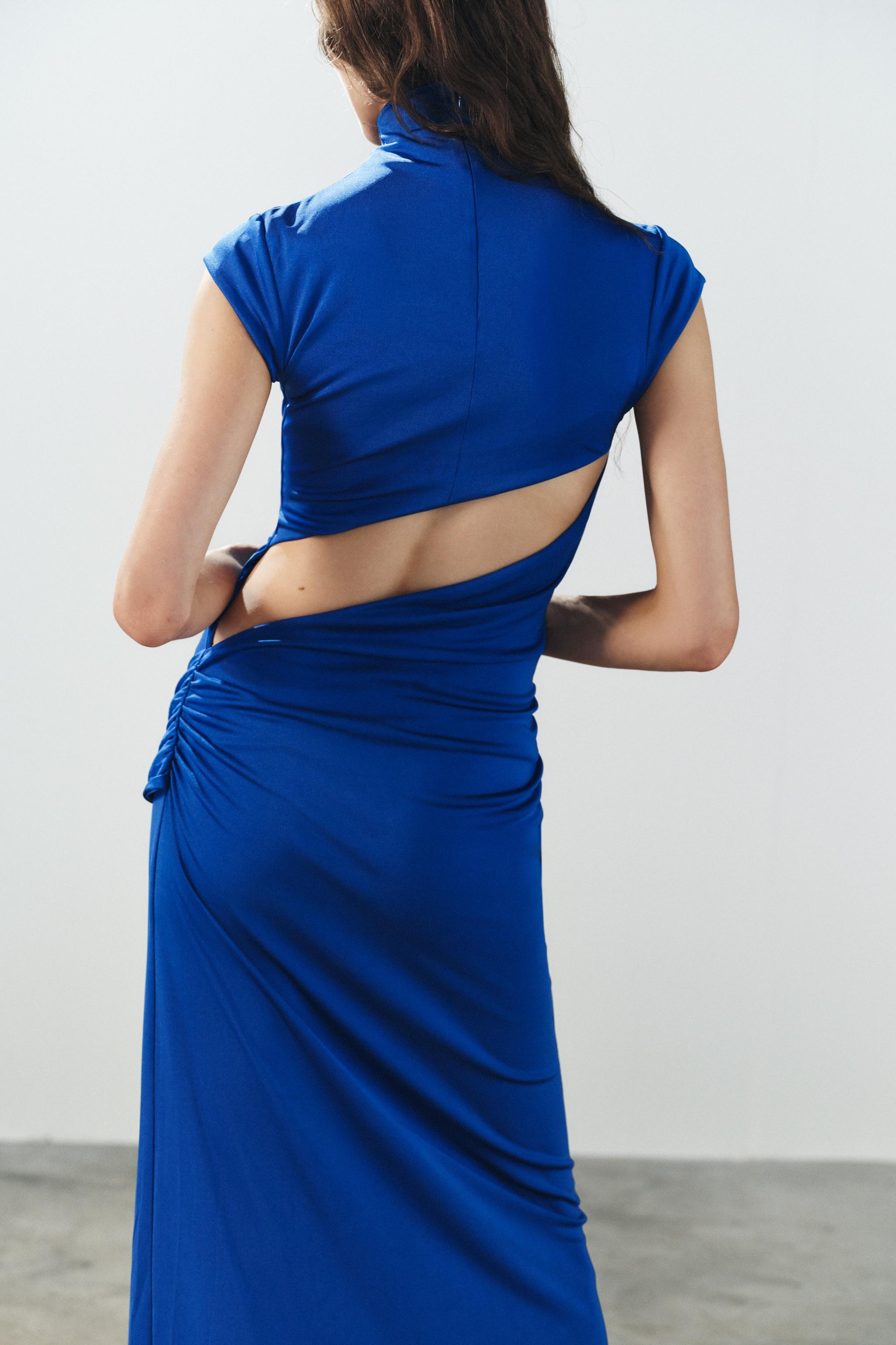 ROBE LONGUE À NŒUD ET OUVERTURE